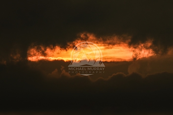 Perfect photo for skygazers who want to wonder where the sunset portal picture goes amid the sun and clouds.