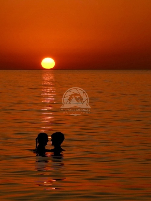 Photo of two friends at sunset at Huntington Beach, Bay Village, Ohio in Cleveland Metroparks.