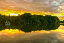 Partly cloudy skies help produce wonderful photos like this Hinckley Lake sunset (the canoe was a bonus).